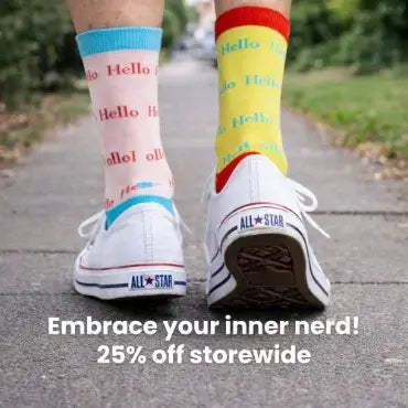 Person wearing colorful socks and white sneakers with a promotional message on a sidewalk.