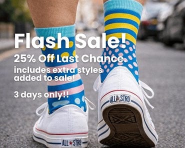 Colorful socks with text overlay on a street background