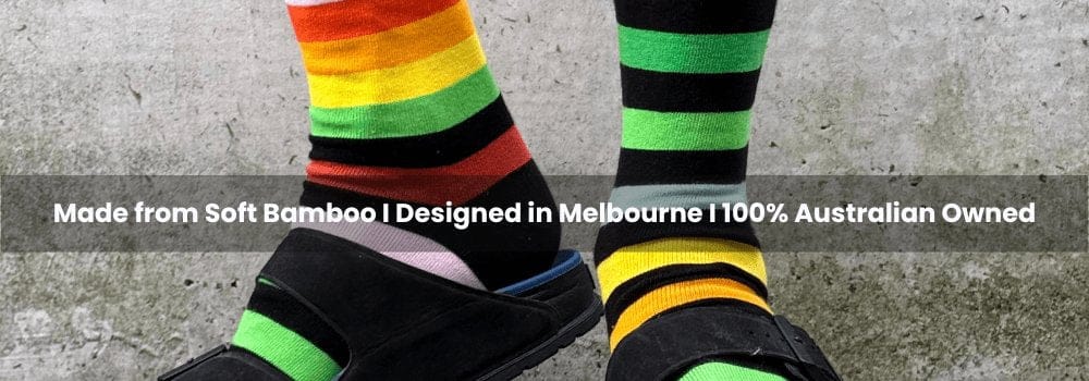 Colorful striped socks on feet with text about product details.