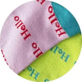 Two fabric swatches, one pink with red text and one green with blue text, on a white background.